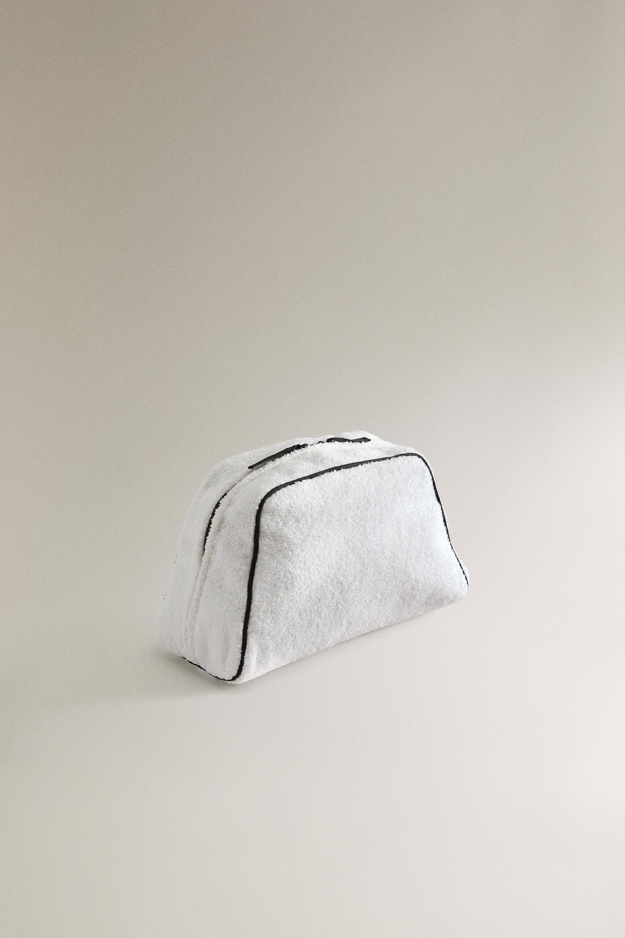 TERRY CLOTH TOILETRY BAG WITH PIPING DETAIL